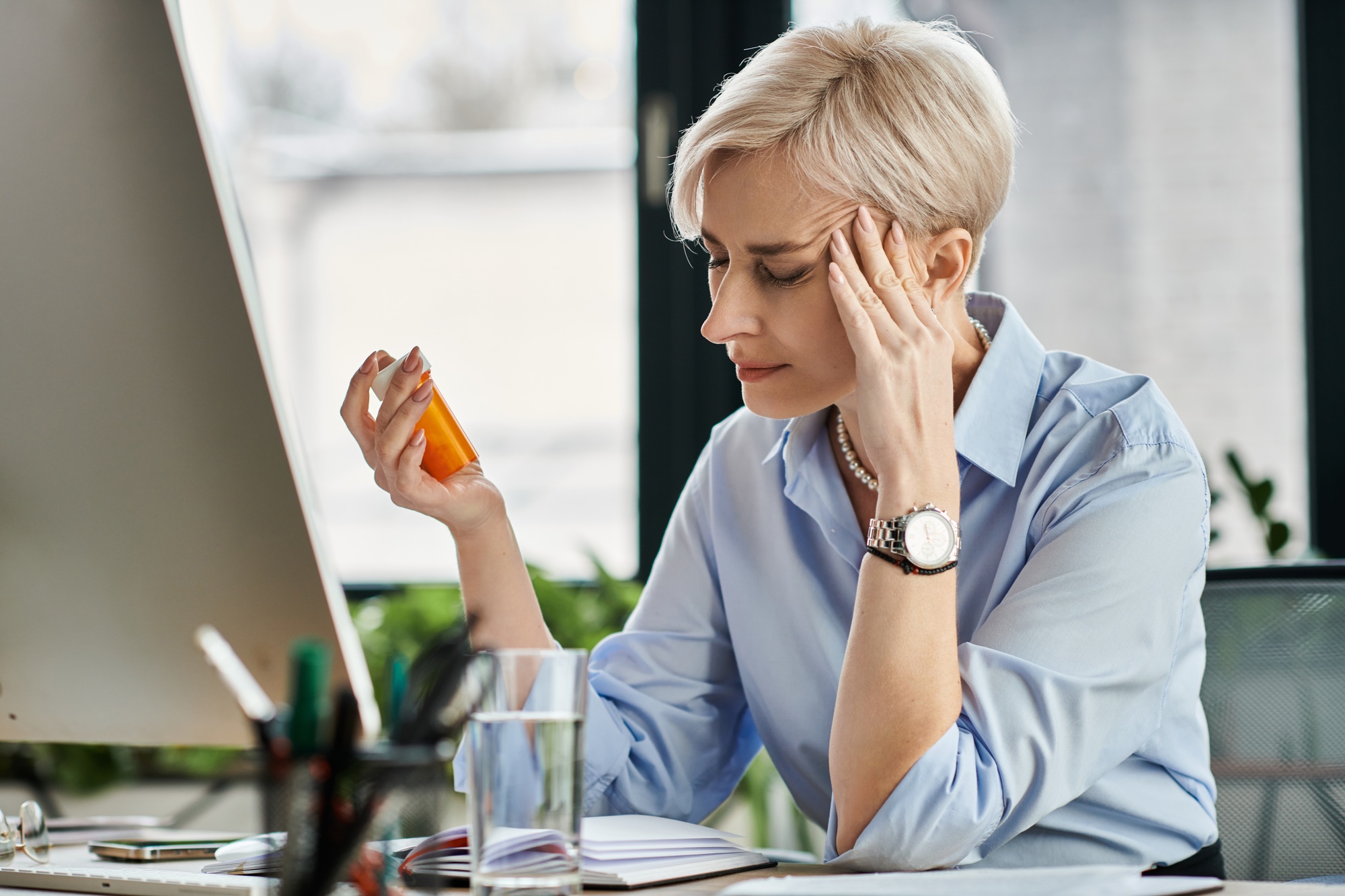 The menopausal maestro: a businesswoman having menopause symptom